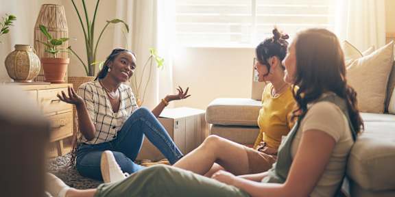 Group of friends are talking at Eastside Haven at 17th Apartments, Costa Mesa